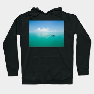 Aerial view of fishing boat on emerald sea Hoodie